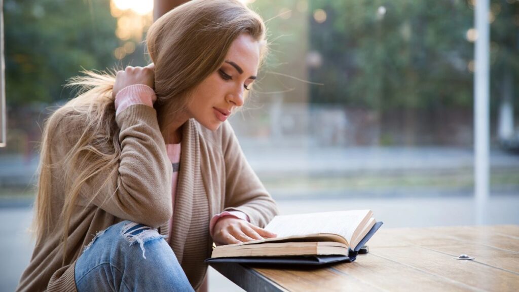 woman reading at the table