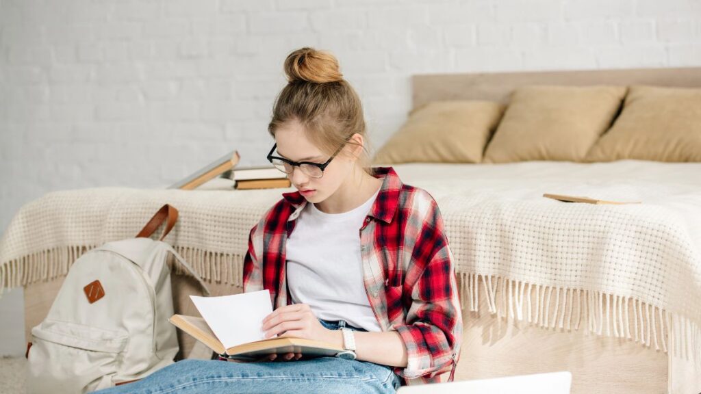 woman reading by bed