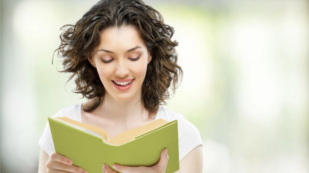 woman reading green book