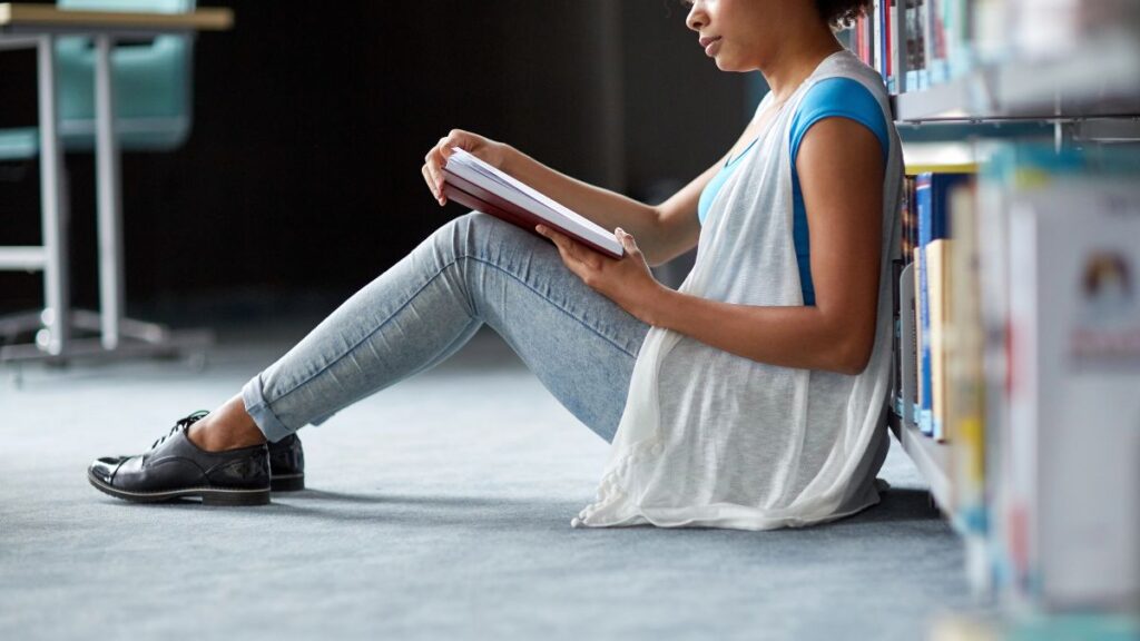 woman reading in library