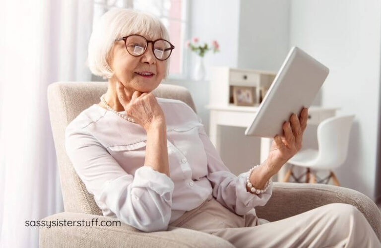 woman sitting in a chair reading a book about intentionally living quotes.