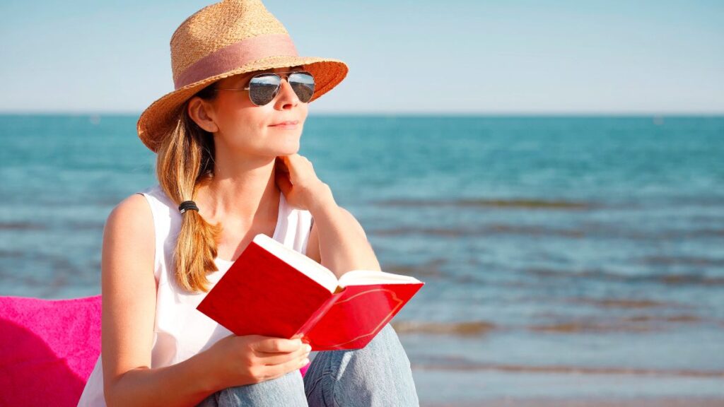 woman reading on beach