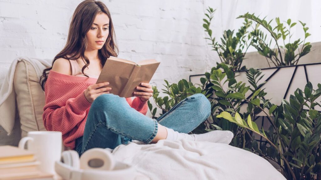 woman reading on bed