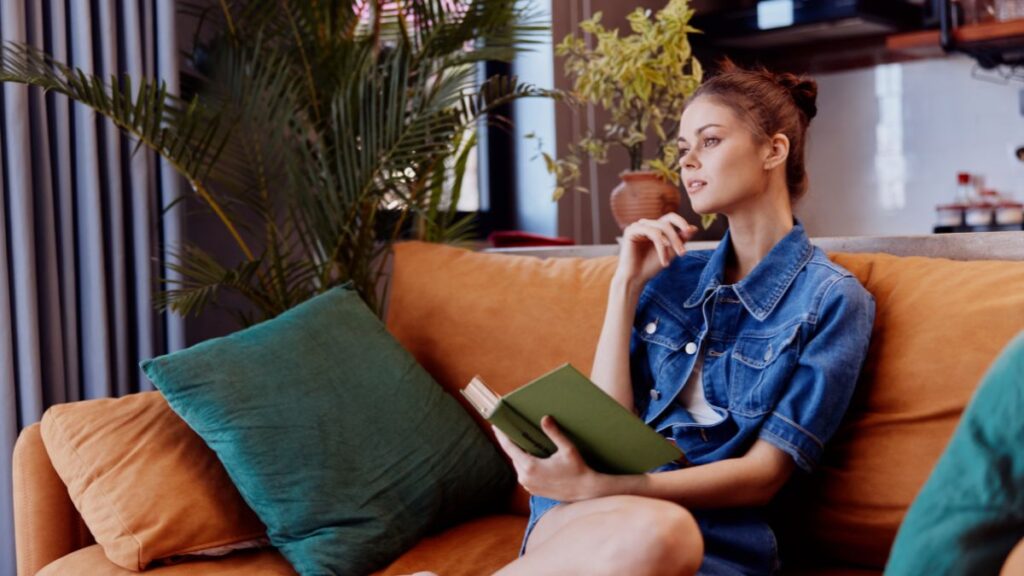 woman reading on couch