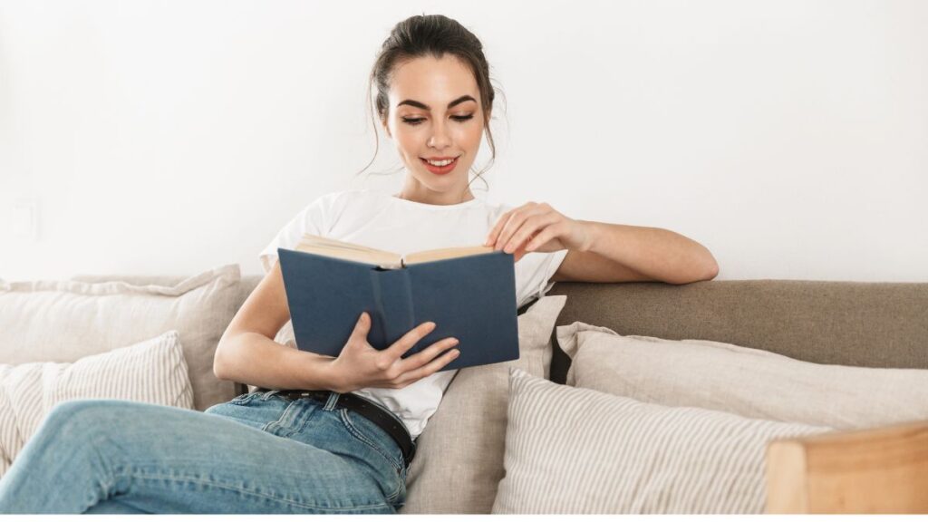 woman reading on couch