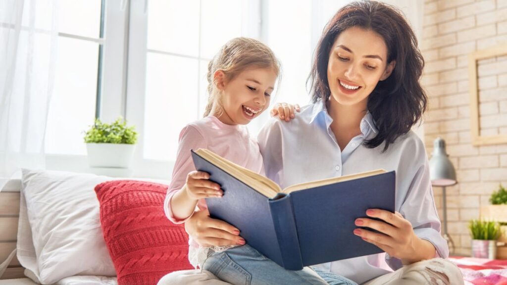 woman reading on couch with daughter