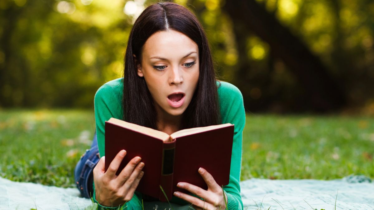 woman reading on the grass