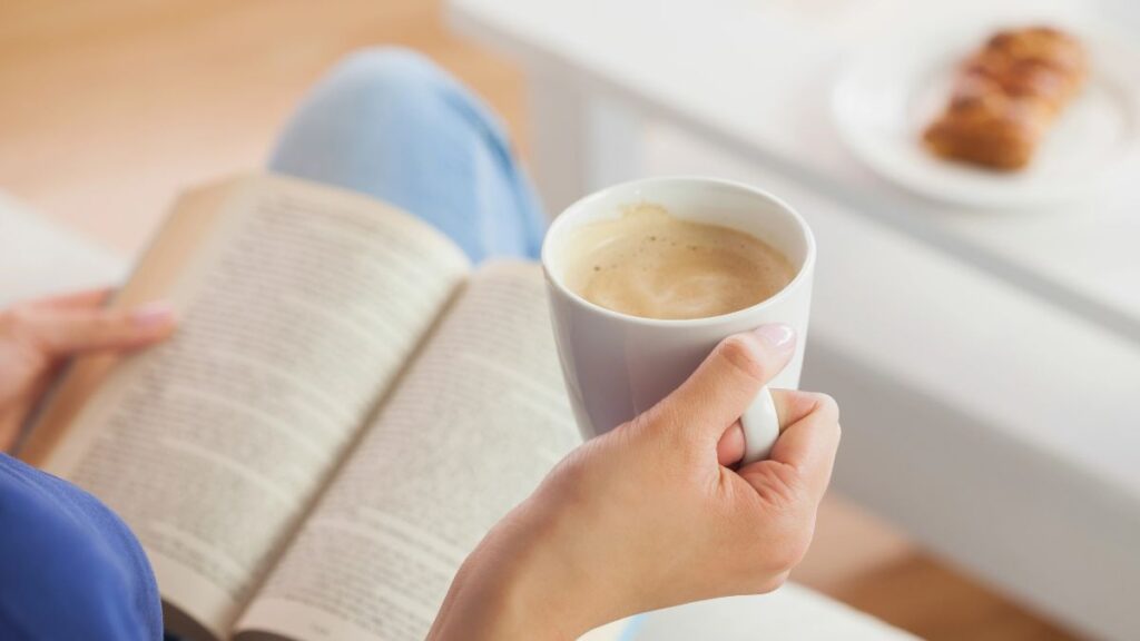 woman reading with coffee