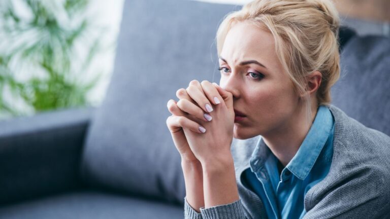 woman stressed on couch