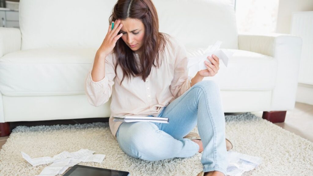 woman stressed with bills