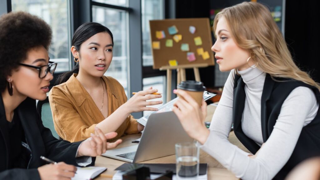 women working in a group on computer