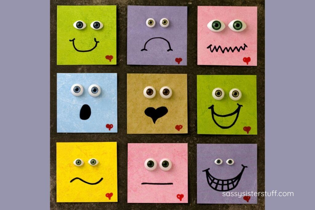 nine sticky notes with different kinds of faces on them showing various emotions.