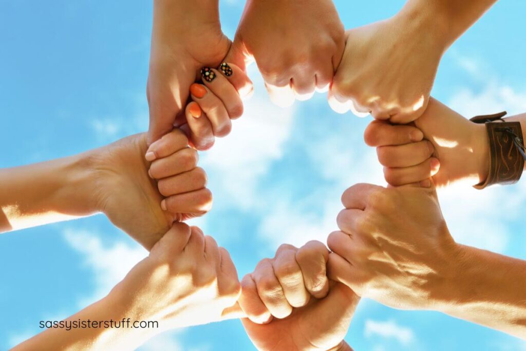 8 hands form a circle to show unity of friends.