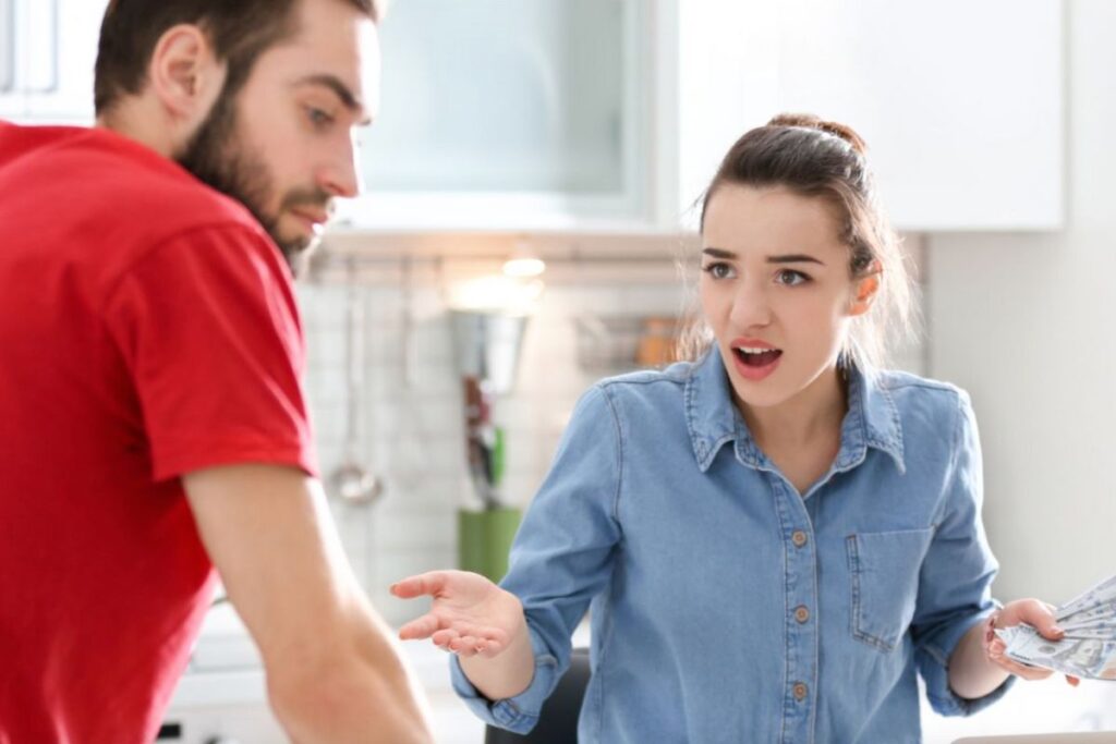 Woman and man arguing over money - 