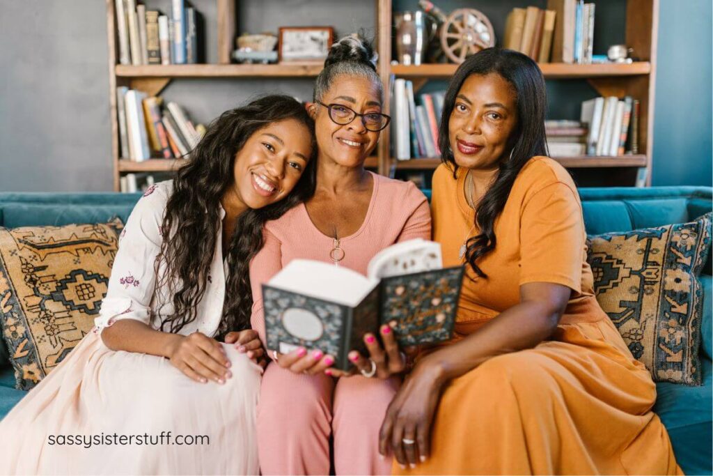 three generations of women pose together for a photo.