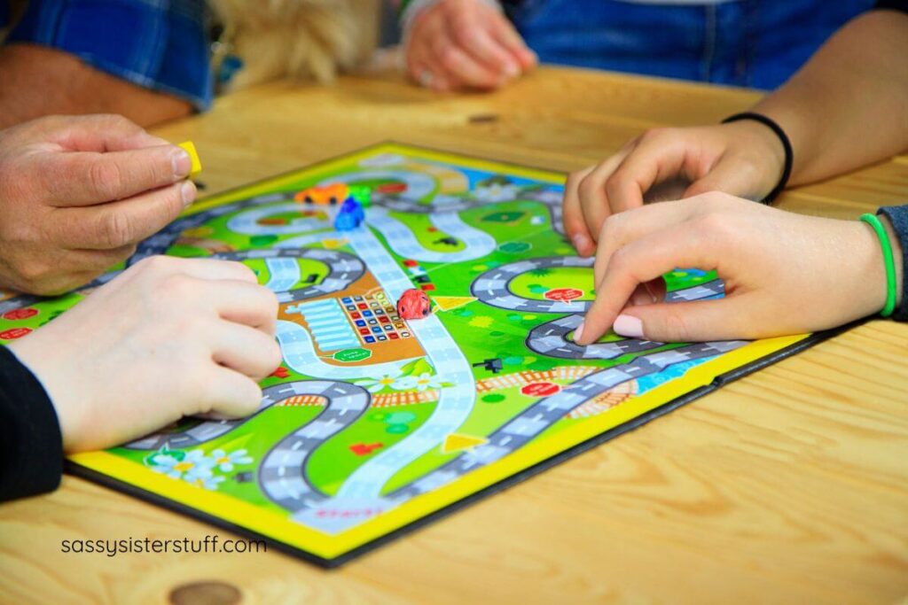 closeup of people playing a board game.