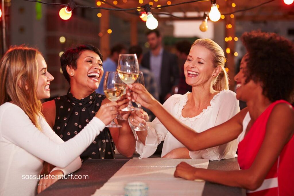 four middle aged girlfriends toast to the 10 benefits of social interaction.