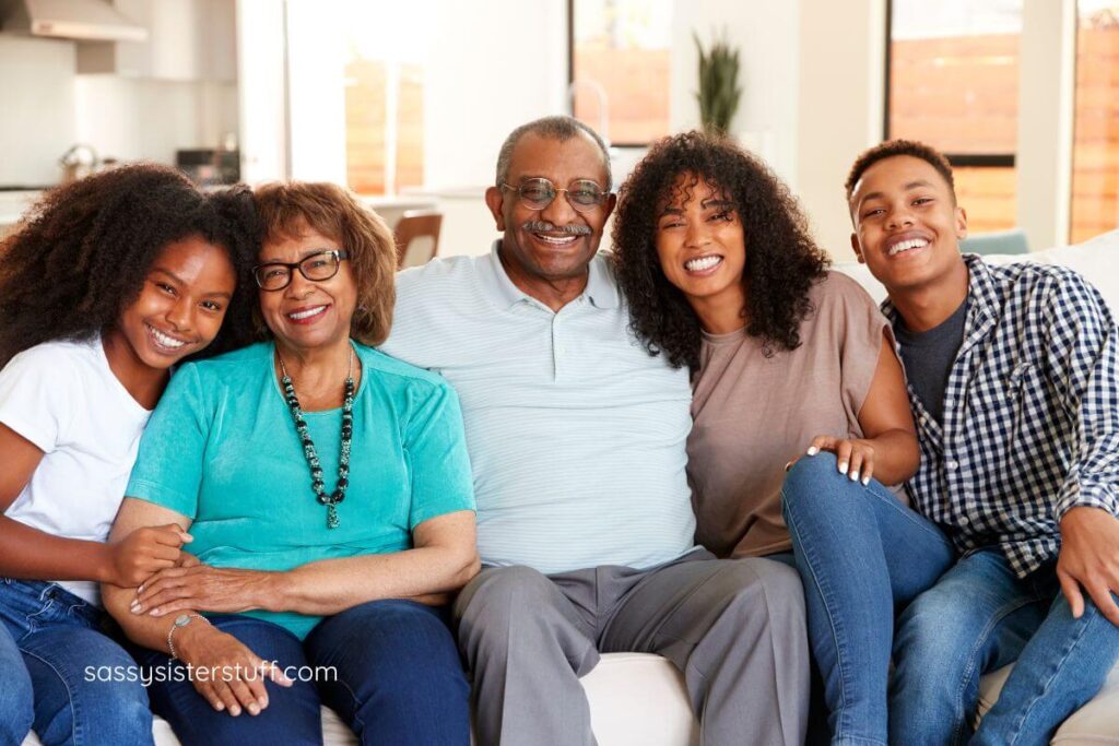 grandparents and three teenage grandchildren pose for a photo together.