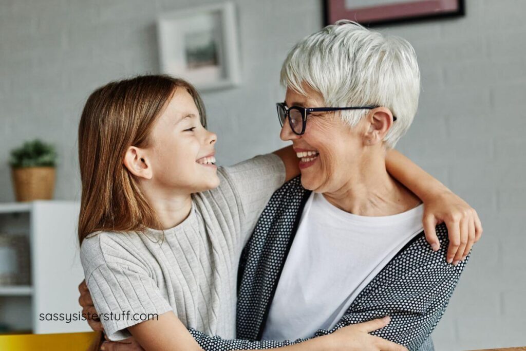 school age child has her arm around grandma and they are laughing and having fun.