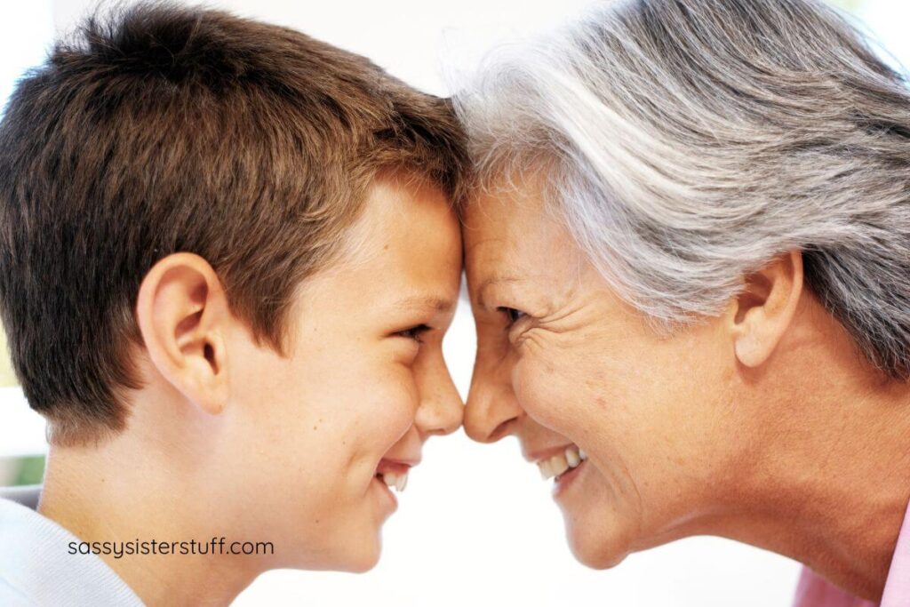 close up of grandmother and young grandson nose to nose.