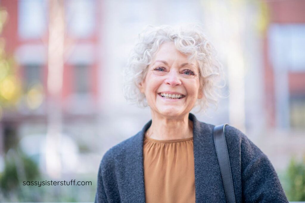 beautiful older woman smiles for the camera.