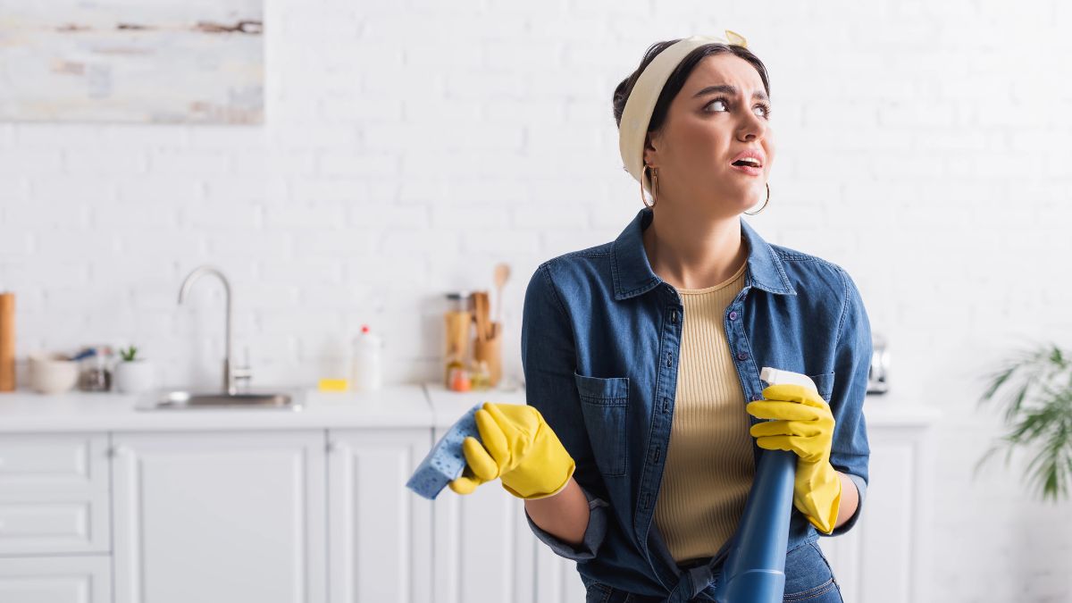 confused woman cleaning