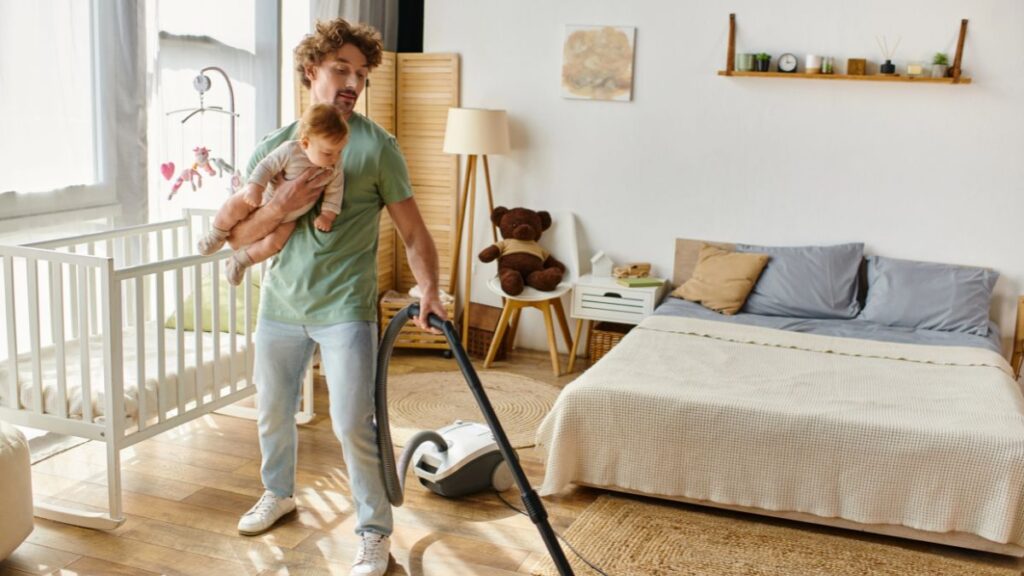 dad and baby vacuuming 