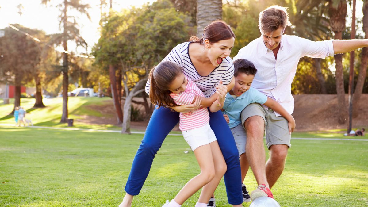 family playing soccer