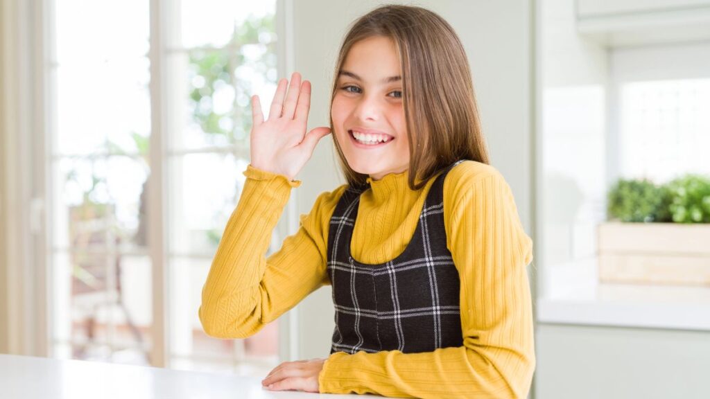 girl waving