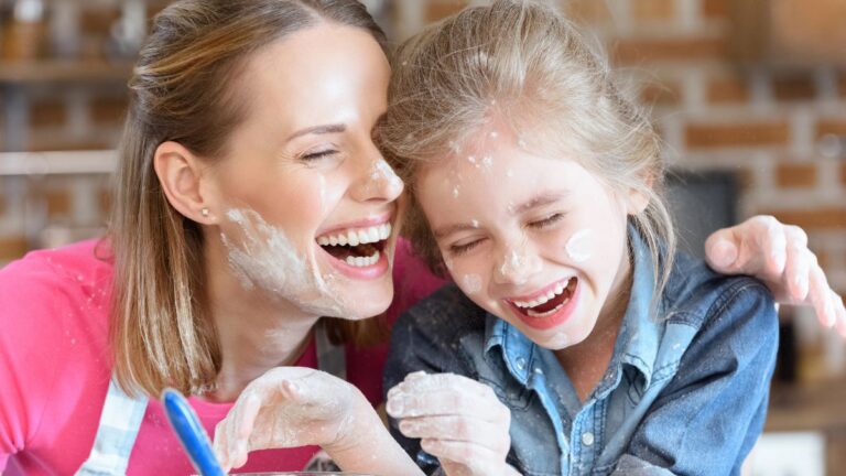 mom and daughter cooking and laughing