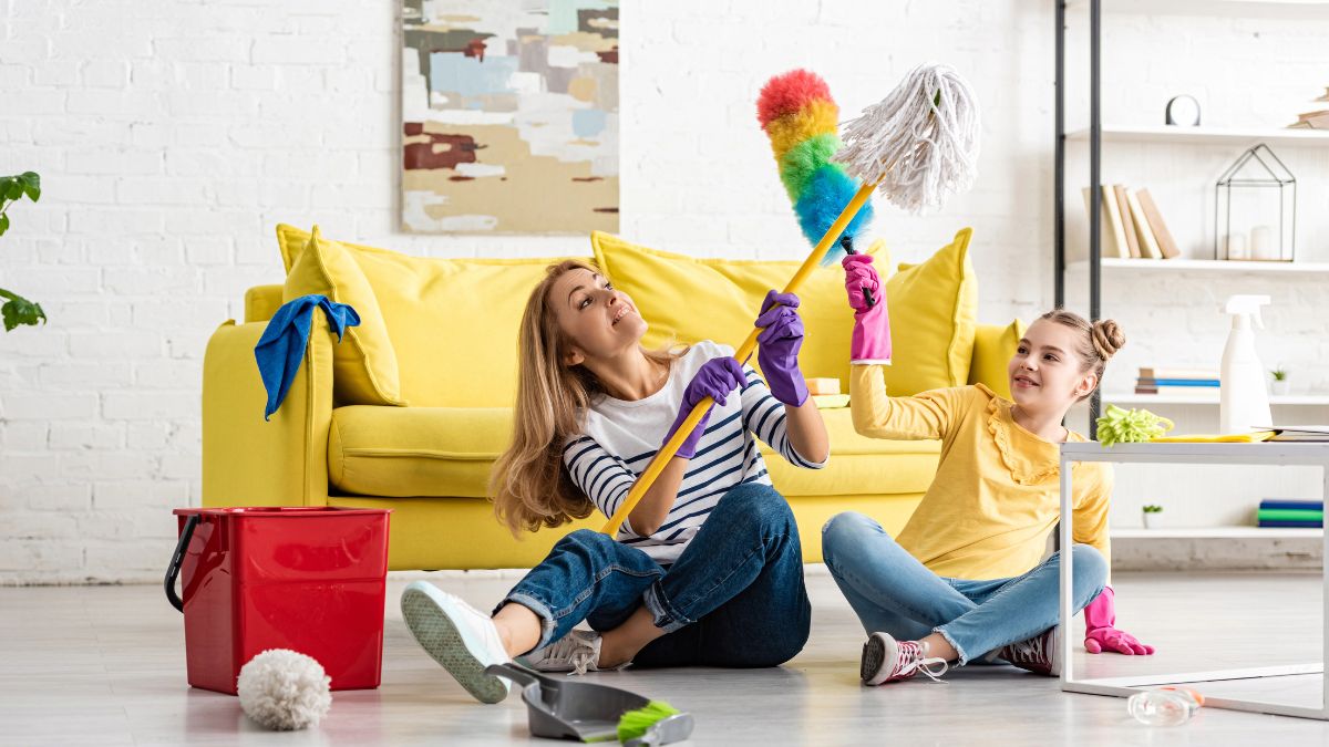 mom and daughter playing with cleaning supplies