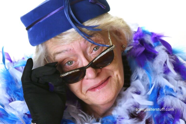 sassy senior lady dressed in feathers, a hat, and sunglasses.