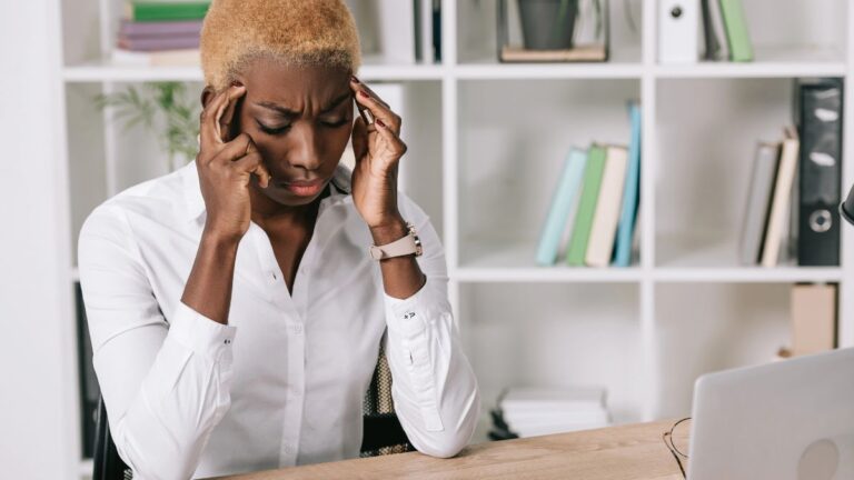 stressed woman holding head