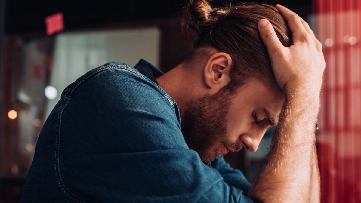 upset man hands on head