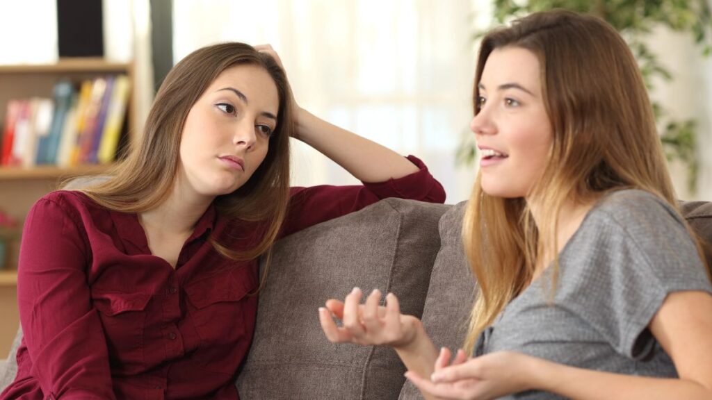 woman looking bored talking to friend