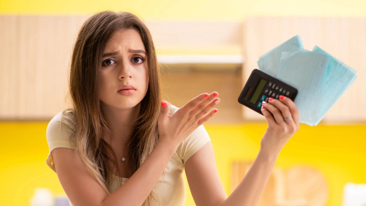 woman looking stressed with bills