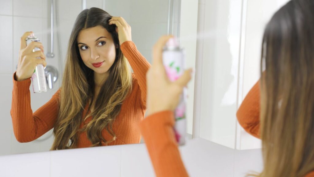 woman using hairspray