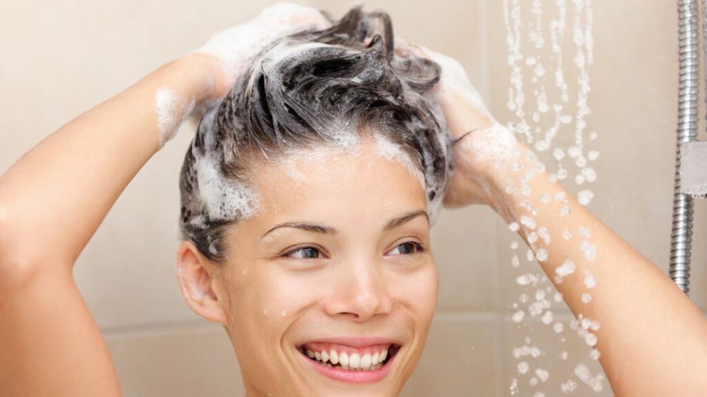 woman washing hair in shower