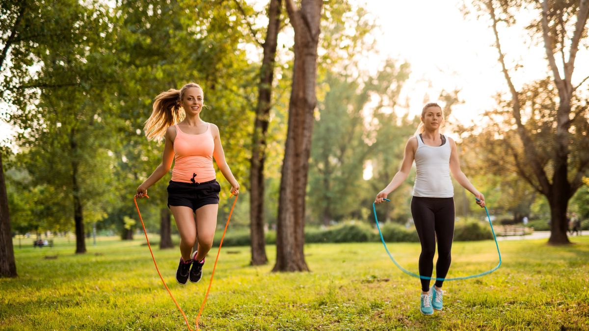 women jumping rope in the park