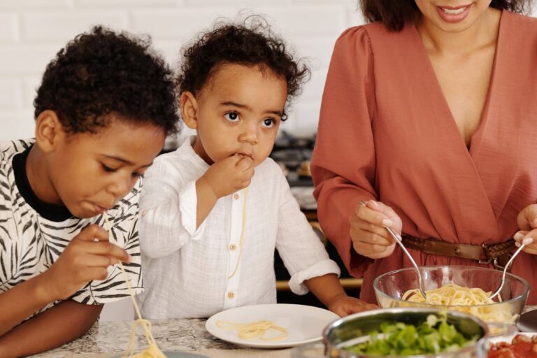 Children Eating Food by Table